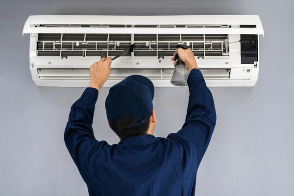 technician-service-cleaning-air-conditioner-600nw-1498805081